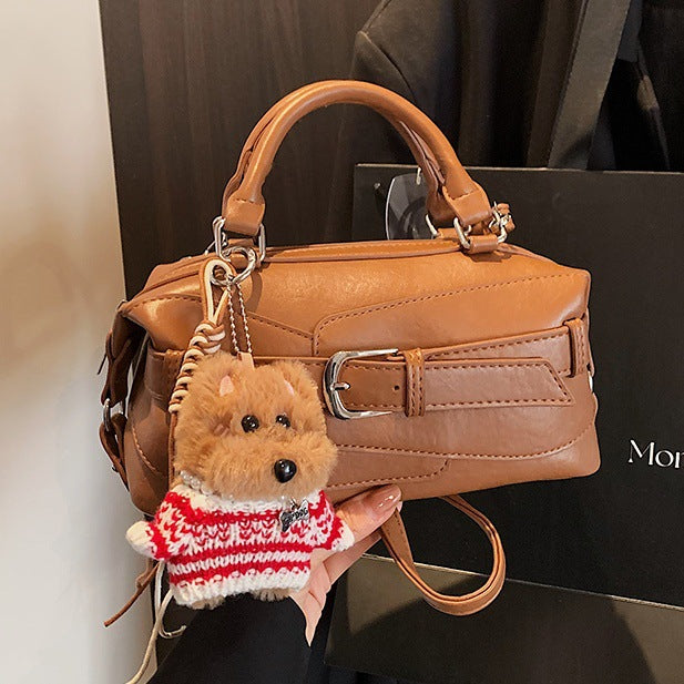 Women's mini handbag with charming animal pendant