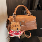 Women's mini handbag with charming animal pendant