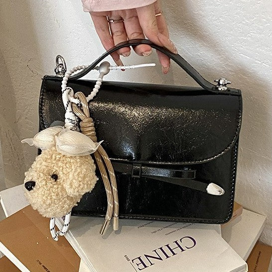 Women elegant mini handbag with cute pendant
