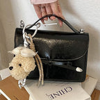 Women elegant mini handbag with cute pendant