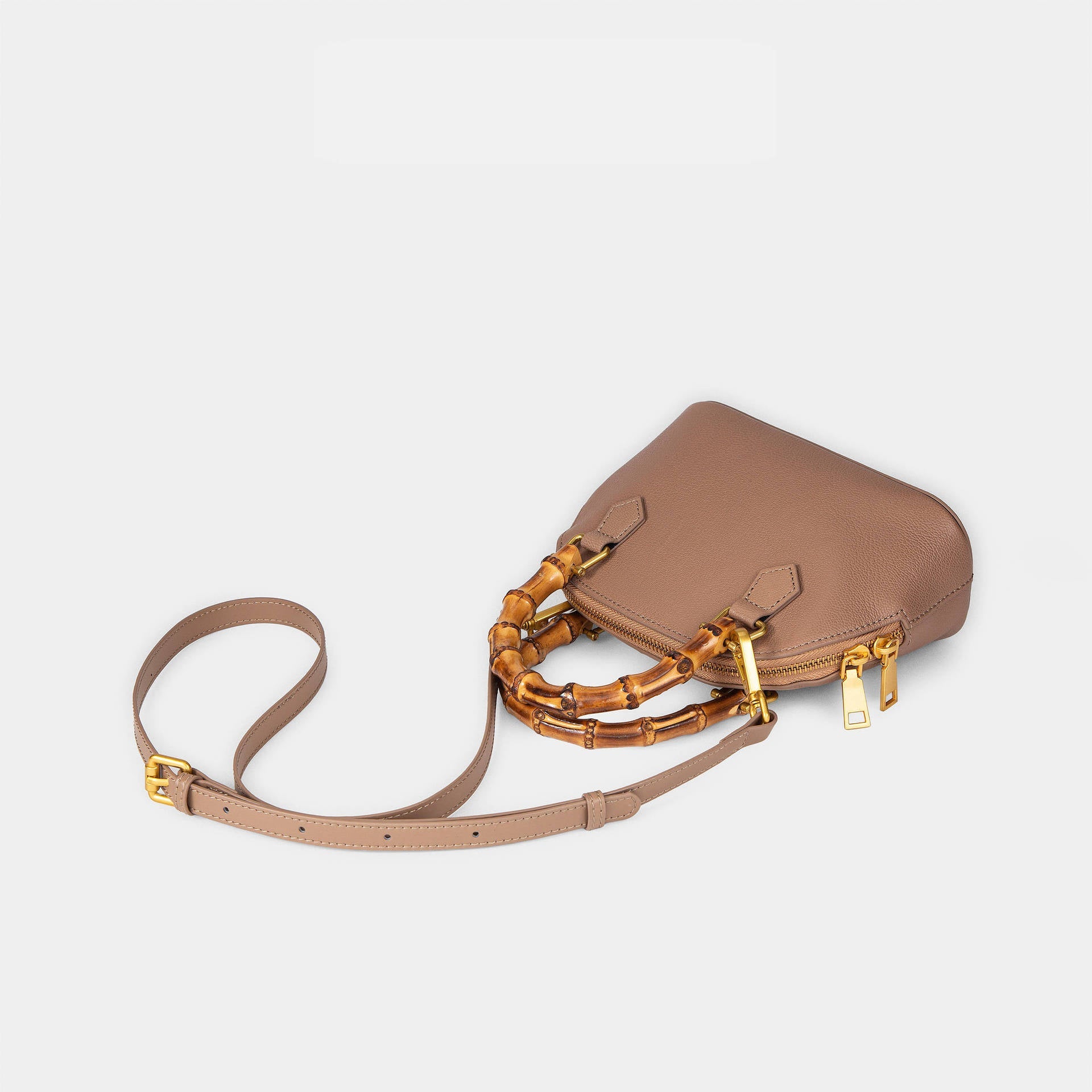 Ladies fashionable mini bag with bamboo handle and elegant leather