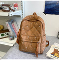 Quilted Backpack with Decorative Tassels