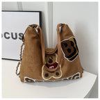 Shoulder bag in playful bear pattern