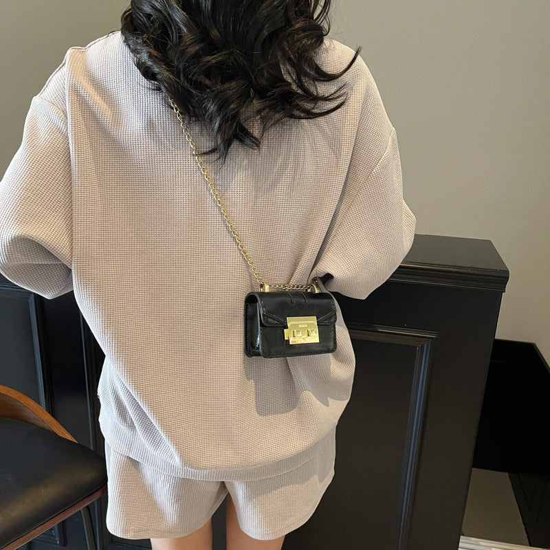 Women's mini handbag with elegant metal accents