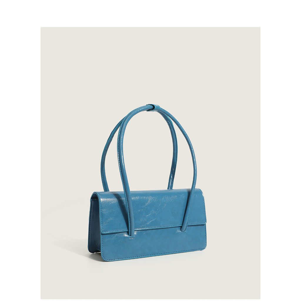 Ladies elegant handbag with minimalist silhouette