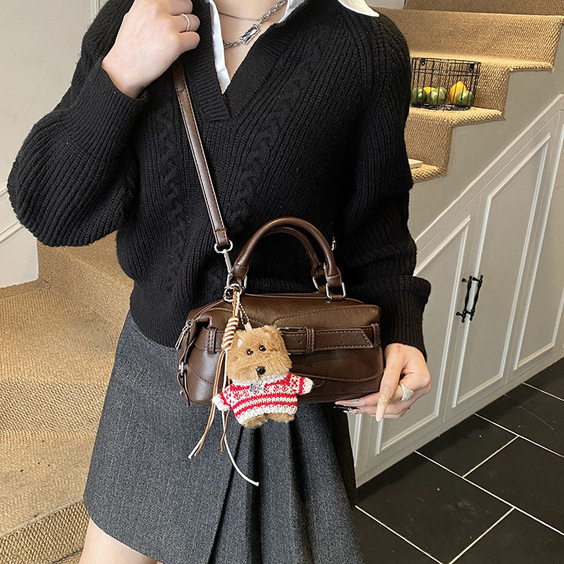 Women's mini handbag with charming animal pendant