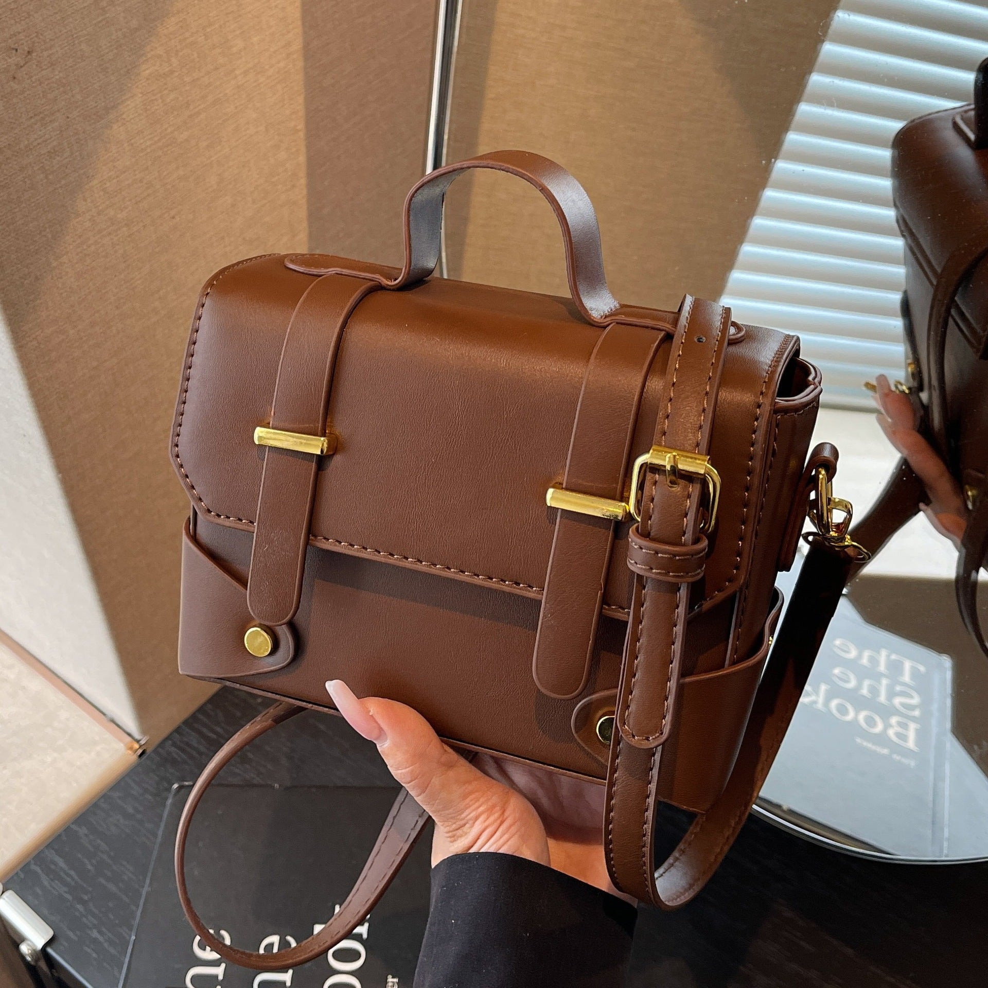 Women's mini handbag with textured design and detachable shoulder strap