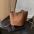 Women's mini bag made of soft suede with adjustable shoulder strap