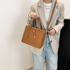 Women's elegant handbag in minimalist design with detachable shoulder strap