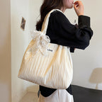 Leisure bag with structured design and playful scarf