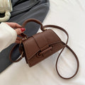 Women's mini handbag with textured leather and stylish closure