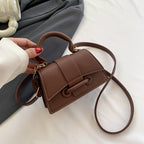 Women's mini handbag with textured leather and stylish closure