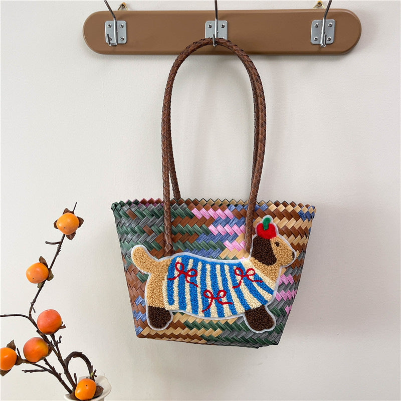 Shoulder bag with playful dog motif