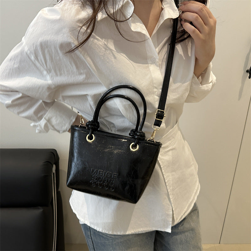 Women elegant mini handbag with structured design and removable shoulder strap