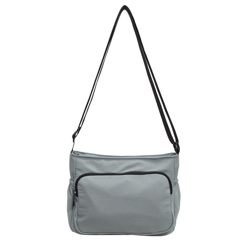 Practical shoulder bag with versatile storage compartments
