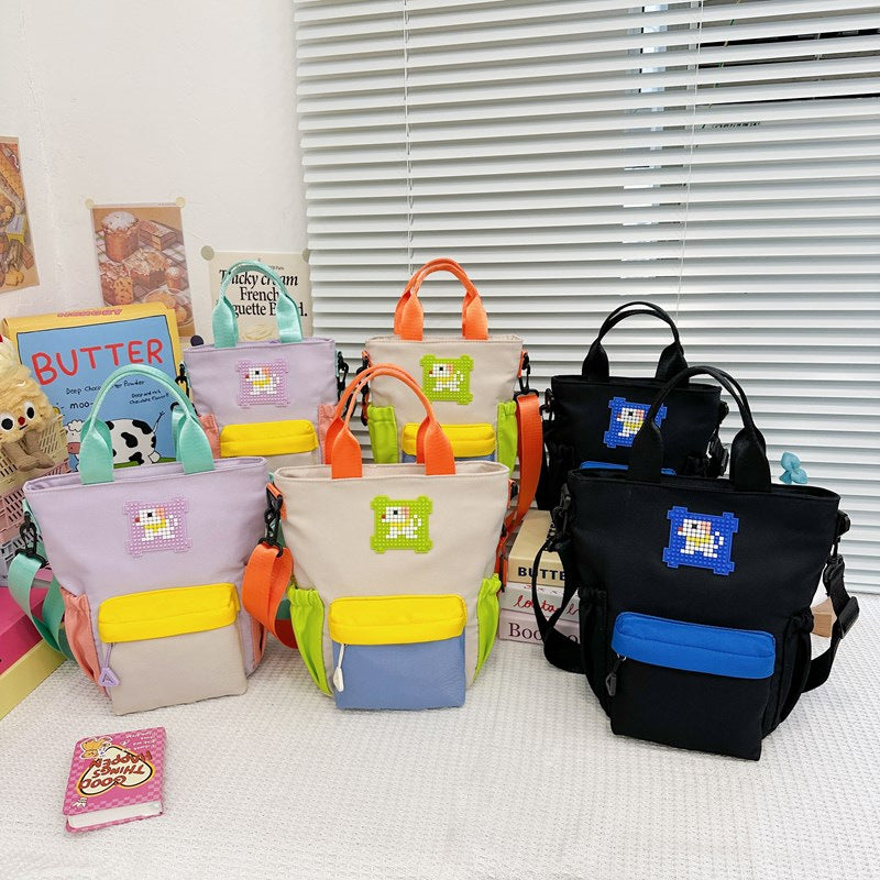Mini handbag with colorful accents and practical carrying system