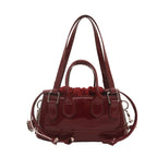 Women's mini bag with playful drawstring and shiny finish