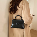 Women's handbag with textured design and elegant closure
