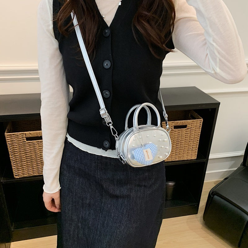 Ladies trendy mini handbag with striking pearl applications