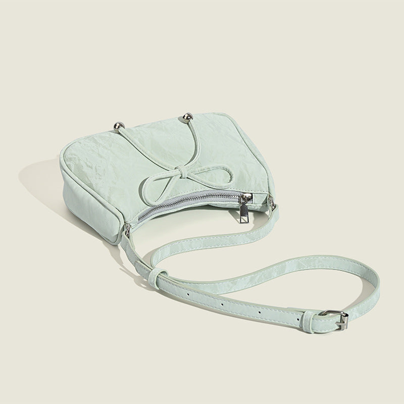 Ladies elegant mini handbag with playful drawstring