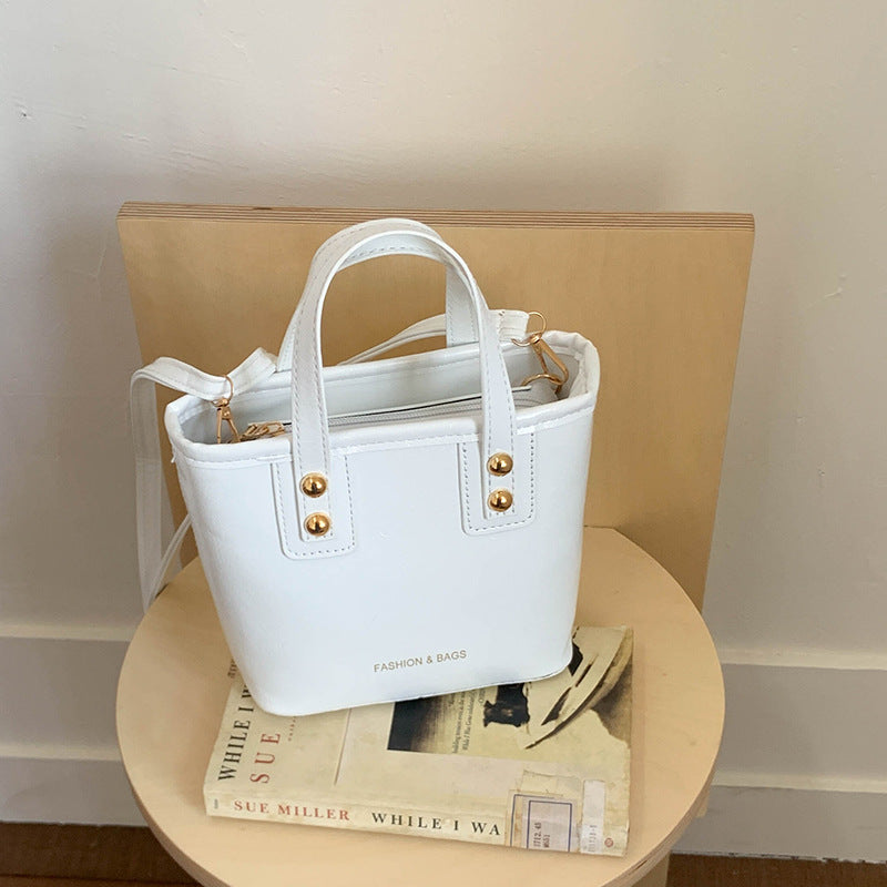 Women's mini bag with elegant structure and practical carrying handle