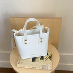 Women's mini bag with elegant structure and practical carrying handle