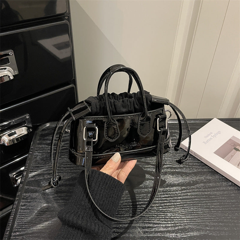 Women's mini bag with playful drawstring and shiny finish
