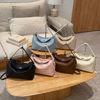 Women's handbag with flexible strap and elegant design