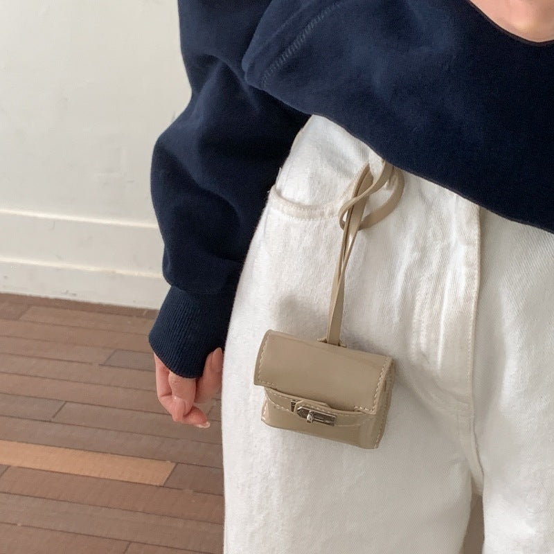 Ladies mini handbag made of high-quality artificial leather with playful closure