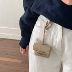 Ladies mini handbag made of high-quality artificial leather with playful closure