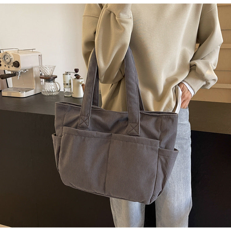 Multifunctional shoulder bag with large outer pockets