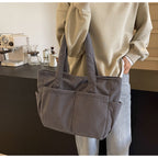 Multifunctional shoulder bag with large outer pockets