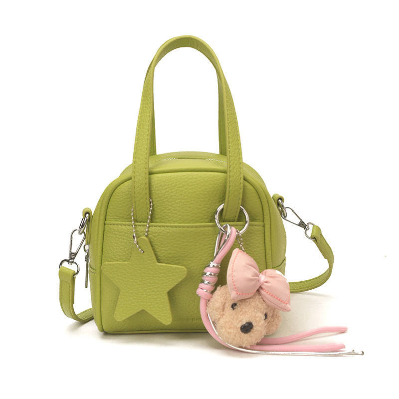 Ladies mini bag with decorative pendant