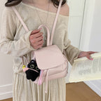 Women's mini backpack with playful pendant