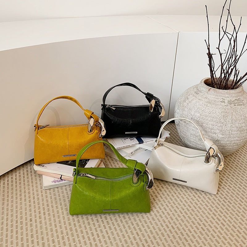 Ladies elegant handbag with minimalist design and noble accents