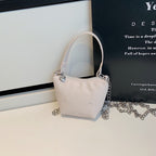 Women's mini handbag with shiny chain and textured upper material