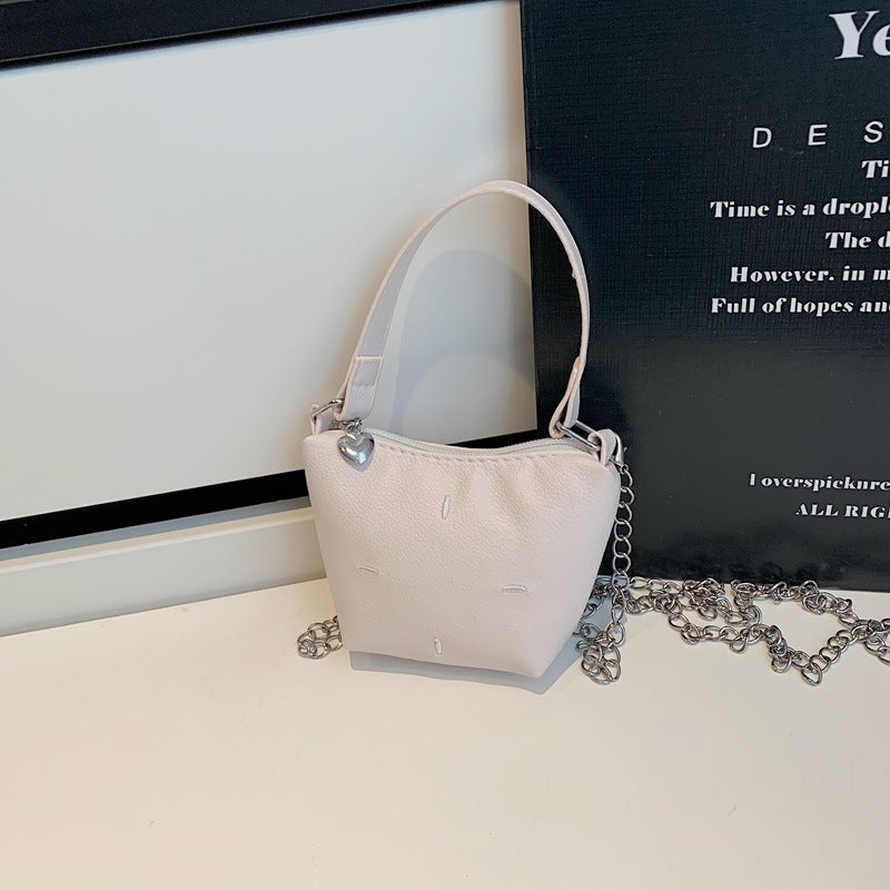 Women's mini handbag with shiny chain and textured upper material