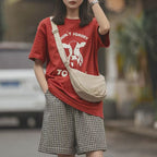 Shoulder bag with practical compartment system and adjustable shoulder strap