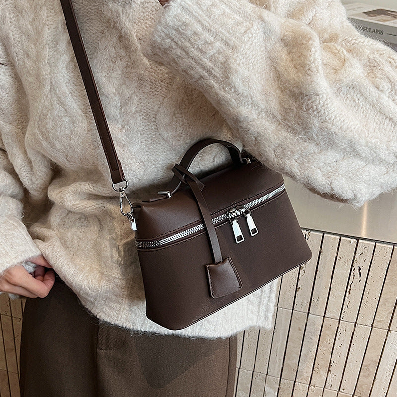 Women's mini shoulder bag with practical compartments