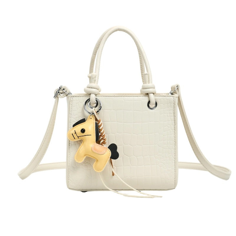 Women's mini bag with animal charm and modern crocodile look