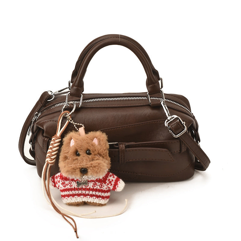 Women's mini handbag with charming animal pendant