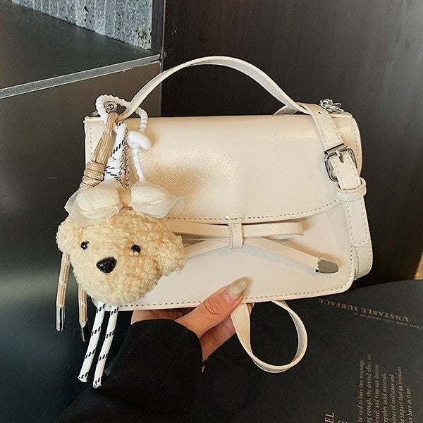Women elegant mini handbag with cute pendant