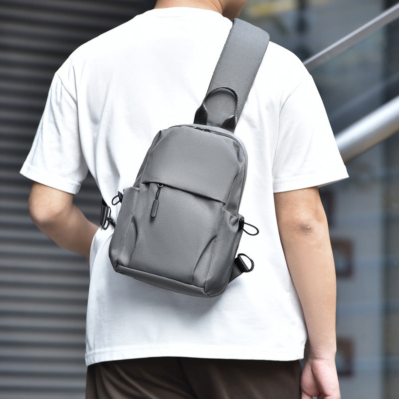 Sling backpack with multiple compartments and ergonomic design