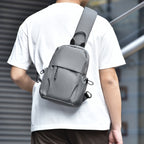 Sling backpack with multiple compartments and ergonomic design