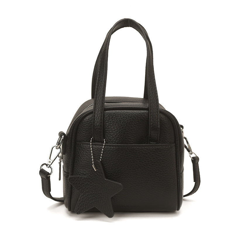 Ladies mini bag with decorative pendant
