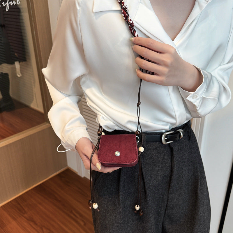 Women's mini handbag with adjustable chain strap and customizable design