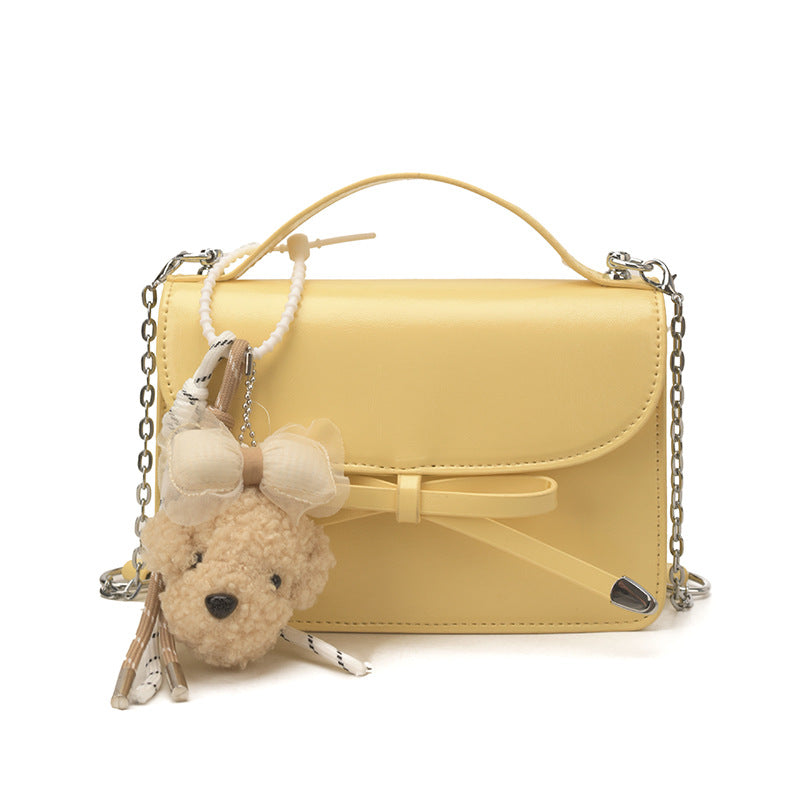 Women elegant mini handbag with cute pendant