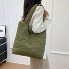 Padded shoulder bag with wave design