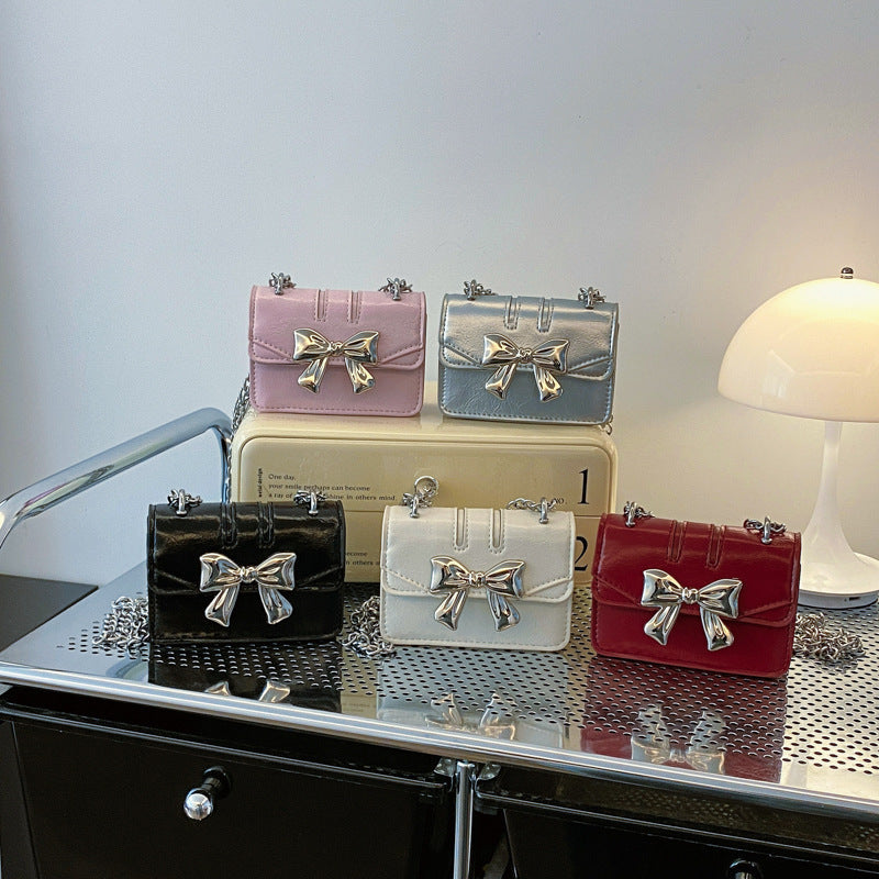 Ladies Mini Handbag with Shimmering Bow Closure
