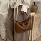 Women's handbag with flexible strap and elegant design